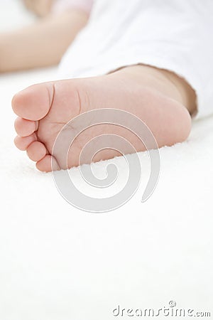 Tiny foot of baby Stock Photo