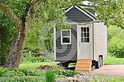 Tiny Gray House on Wheels Stock Photo