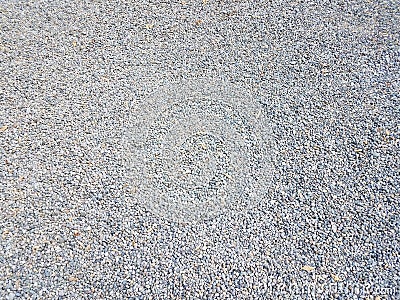 Tiny grey and blue pebbles or gravel on the ground Stock Photo