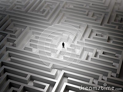 Tiny man in a maze Stock Photo