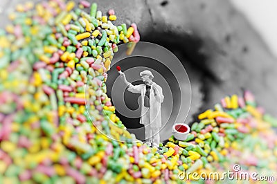 Tiny painter paints a donut Stock Photo