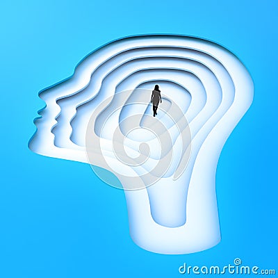 Tiny person standing inside a head silhouette. Stock Photo