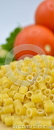 Tiny pieces of macaroni, parsley, tomatoes and egg Stock Photo