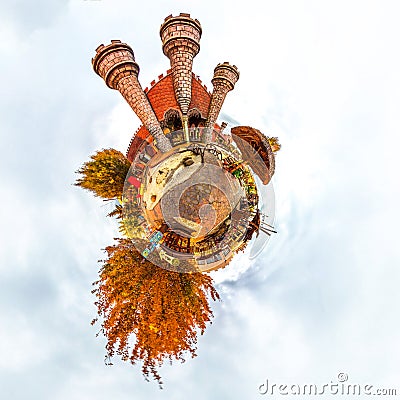 Tiny planet with fantasy old children`s castle and trees. Orange color. Autemn. Editorial Stock Photo