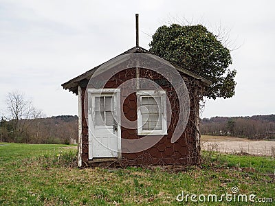 Tiny Rustic House in Countryside Stock Photo