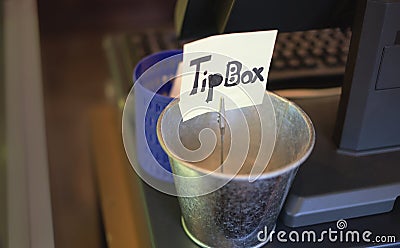 Tip box on counter Stock Photo