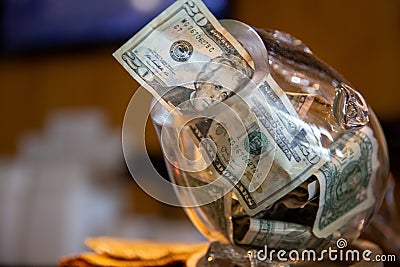 Tip jar with a 20 as gratuity Stock Photo
