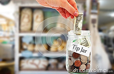 Tip jar money in a restaurant Stock Photo