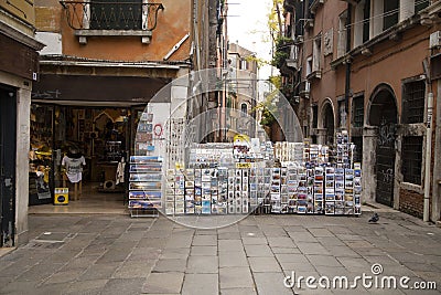 Tipical tourist postcard stall in a Venetian street in a sunny day Editorial Stock Photo