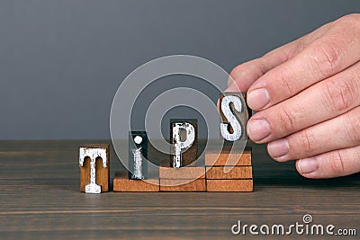 TIPS. Training, service and quality concept. Wooden alphabet letters on steps Stock Photo