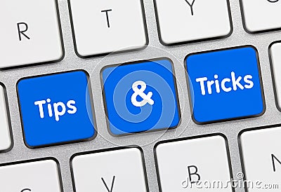 Tips & Tricks - Inscription on Blue Keyboard Key. Stock Photo