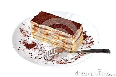 Tiramisu cake/ dessert with cacao and fork on a porcelain plate on the white background. Stock Photo