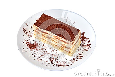 Tiramisu cake/ dessert with cacao on a porcelain plate on the white background Stock Photo