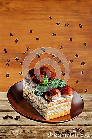 Tiramisu cake flying with mint leaves Stock Photo