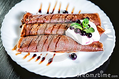 Tiramisu Pancakes with cream and berries, sweet, watering chocolate Stock Photo