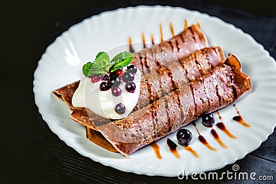 Tiramisu Pancakes with cream and berries, sweet, watering chocolate Stock Photo