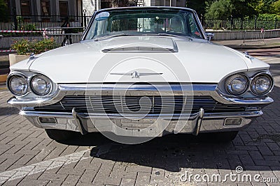 1965 White Ford Thunderbird Hardtop retro car displayed in the 'Automotive Fair Albania'. Editorial Stock Photo