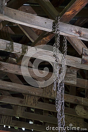 Tire chains hanging from rafters Stock Photo