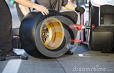Tire change during pitstop Stock Photo