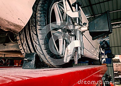 Tire clamped with lazer aligner Stock Photo