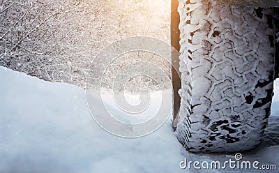 Tire on the snowy road Stock Photo