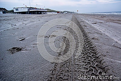 Tire tracks on beach Stock Photo