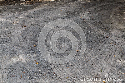 Tire tracks on gravel road Stock Photo