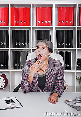 Tired bored business woman yawning. Overwork concept Stock Photo