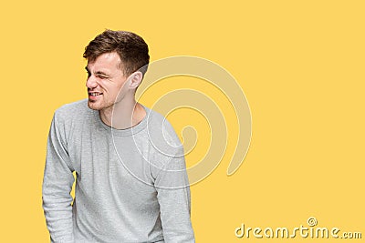 Tired businessman or The serious young man over yellow studio background with pain Stock Photo