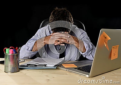 Tired businessman suffering work stress wasted worried busy in office late at night with laptop computer Stock Photo