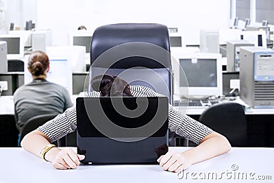 Tired businesswoman at office Stock Photo