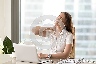 Tired businesswoman suffering of office syndrome Stock Photo