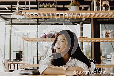 tired businesswoman wake up after sleep at office. exhausted woman dozing at workplace. overwork, fatigue concept Stock Photo