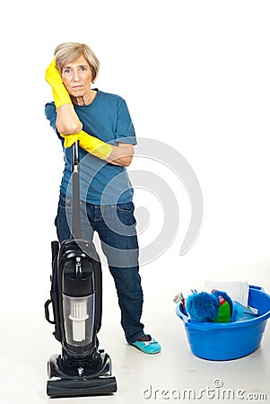 Tired cleaning senior woman Stock Photo