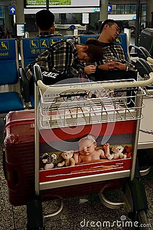 Tired couples in airport Editorial Stock Photo