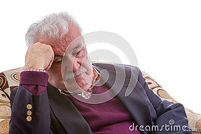 Tired elderly retired man sitting thinking Stock Photo