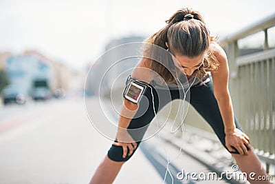 Tired fitness young woman catching breathe Stock Photo