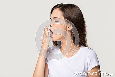 Tired funny sleepy girl student yawning isolated on background Stock Photo