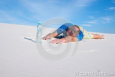 Tired man suffering from thirst lost in the desert Stock Photo