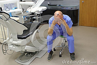 Tired mature dentist with eyes problem Stock Photo