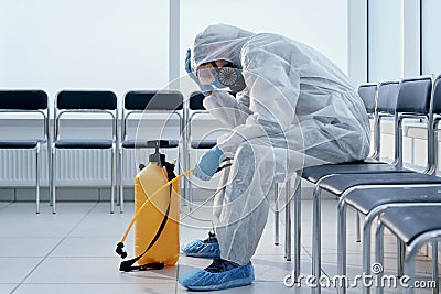 tired medical orderly in a biohazard suit. Stock Photo