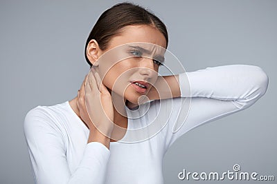 Tired Neck. Beautiful Woman Suffering From Pain, Painful Feeling Stock Photo