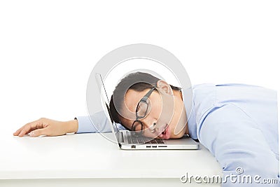 Tired overworked businessman sleeps on laptop Stock Photo