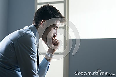 Tired pensive businessman Stock Photo