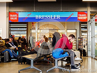 Tired people passengers waiting in the terminal in small Baden Airport with Editorial Stock Photo