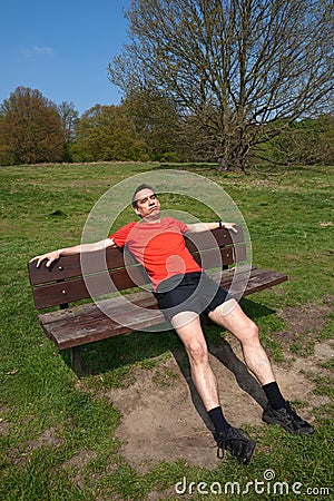 Qui sera des séries? Tired-runner-resting-sunny-park-bench-19250535