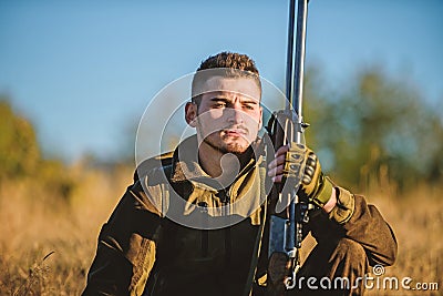 Tired but satisfied. End of season. Hunter enjoy nature view. Hunting hobby leisure. Hunter satisfied with catch Stock Photo