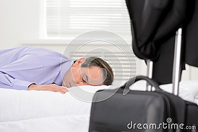 Tired senior executive. Tired mature businessman lying on the so Stock Photo