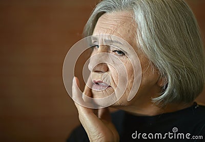 Tired senior woman Stock Photo