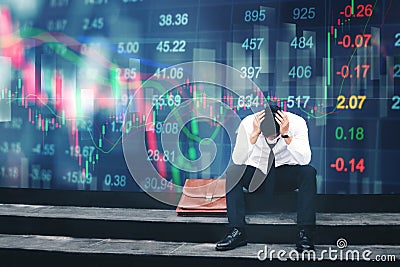 Tired or stressed businessman sitting on the walkway in panic di Stock Photo